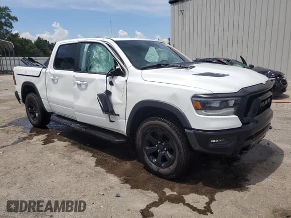 ✅ 2022 Ram 1500 Rebel • VIN: 1C6SRFLT9NN141285 • Lot: 70023735. Wystawiony na Copart z przebiegiem 128 655 mil. Bezpłatny archiwum sprzedaży aukcyjnych z USA i szczegółowy raport historii pojazdu na DreamBid. Zdjęcie 4.