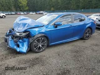 2018 Toyota Camry Hybrid XLE с VIN 4T1B21HK8JU004995, выставлен на аукционе Copart как лот 84915895 с пробегом 98 549 миль миль и Списание • Salvage title. История ставок и продаж доступна на DreamBid. Изображение 1.