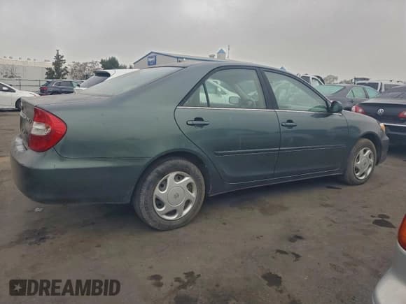 ✅ 2002 Toyota Camry XLE • VIN: JTDBE30K420099583 • Lot: 94325855. Listed on Copart with 202,517 mi. Free auction sales archive from the USA and detailed vehicle history report at DreamBid. Image 3.