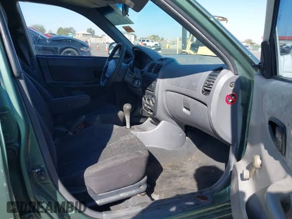 2005 Hyundai Accent GLS z VIN KMHCG45C95U620716, wystawiony jako IAAI lot #41740573 z przebiegiem 187 971 mil mil oraz . Historia ofert i sprzedaży dostępna na DreamBid. Obrazek 5.