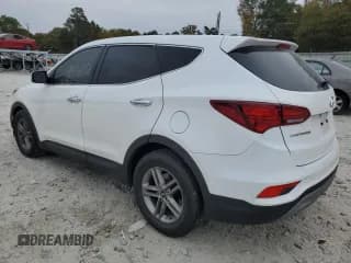 ✅ 2018 Hyundai Santa Fe 2.4L • VIN: 5NMZTDLB7JH098996 • Лот: 64157592. Опубликован ранее на Copart с пробегом 94 097 миль. Бесплатный доступ к архиву аукционных продаж из США и подробный отчёт об истории автомобиля на DreamBid. Изображение 3.