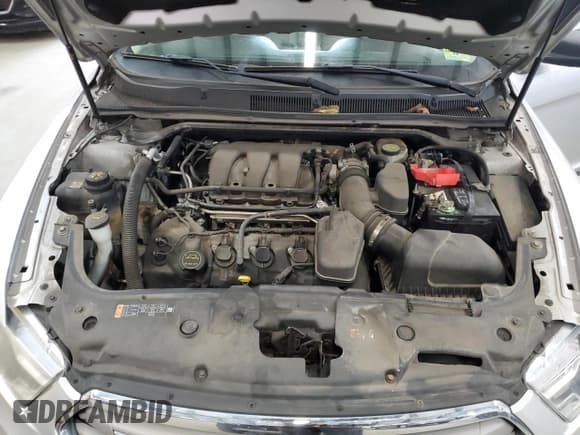 ✅ 2016 Ford Taurus SE • VIN: 1FAHP2D82GG102742 • Lot: 90435725. Listed on Copart with 130,509 mi. Free auction sales archive from the USA and detailed vehicle history report at DreamBid. Image 11.