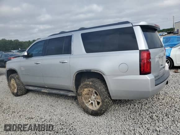 2015 Chevrolet Suburban LT with VIN 1GNSKJKC9FR147607, listed as a Copart auction lot 82344395 with 164,883 mi miles and Salvage title. Bid and sale history available at DreamBid. Image 2.