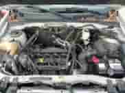 2009 Mercury Mariner with VIN 4M2CU81759KJ04555, listed as a Copart auction lot 85778504 with 130,514 mi miles and Salvage title. Bid and sale history available at DreamBid. Image 14.