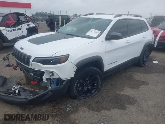 ✅ 2021 Jeep Cherokee Trailhawk • VIN: 1C4PJMBX4MD239112 • Lot: 42271040. Listed on IAAI with 62,917 mi. Free auction sales archive from the USA and detailed vehicle history report at DreamBid. Image 2.