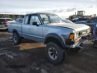 ✅ 1985 Nissan 720 • VIN: JN6ND06Y9FW005739 • Lot: 88131665. Wystawiony na Copart z przebiegiem 134 620 mil. Bezpłatny archiwum sprzedaży aukcyjnych z USA i szczegółowy raport historii pojazdu na DreamBid. Zdjęcie 4.