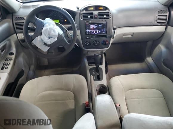 ✅ 2006 Kia Spectra EX • VIN: KNAFE121565357402 • Лот: 72889614. Опубликован ранее на Copart с пробегом 200 657 миль. Бесплатный доступ к архиву аукционных продаж из США и подробный отчёт об истории автомобиля на DreamBid. Изображение 8.