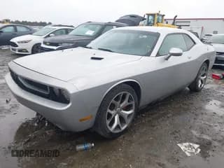 ✅ 2012 Dodge Challenger SXT • VIN: 2C3CDYAG1CH180881 • Lot: 41072621. Wystawiony na IAAI z przebiegiem 147 610 mil. Bezpłatny archiwum sprzedaży aukcyjnych z USA i szczegółowy raport historii pojazdu na DreamBid. Zdjęcie 2.