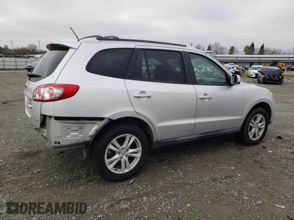 ✅ 2012 Hyundai Santa Fe SE • VIN: 5XYZHDAG7CG108357 • Lot: 85287084. Listed on Copart with 162,684 mi. Free auction sales archive from the USA and detailed vehicle history report at DreamBid. Image 3.