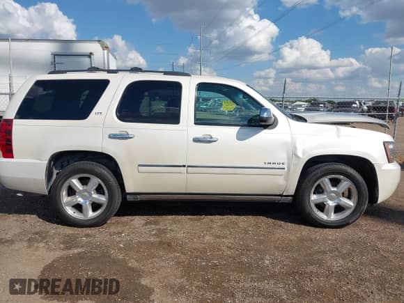2013 Chevrolet Tahoe LTZ with VIN 1GNSCCE09DR357731, listed as a IAAI auction lot 43343449 with 148,667 mi miles and . Bid and sale history available at DreamBid. Image 14.