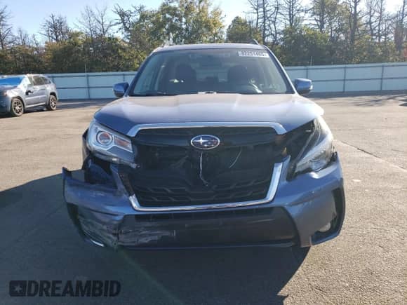 2018 Subaru Forester Touring с VIN JF2SJGWC3JH594474, выставлен на аукционе Copart как лот 82251465 с пробегом 57 066 миль миль и Списание • Salvage title. История ставок и продаж доступна на DreamBid. Изображение 5.