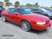 ✅ 1999 Cadillac Eldorado Touring • VIN: 1G6ET1290XU611439 • Lot: 42707144. Listed on IAAI with 127,046 mi. Free auction sales archive from the USA and detailed vehicle history report at DreamBid. Image 1.