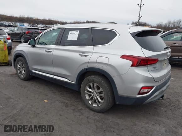 ✅ 2019 Hyundai Santa Fe SE • VIN: 5NMS2CAD7KH054274 • Lot: 43694931. Listed on IAAI with 96,329 mi. Free auction sales archive from the USA and detailed vehicle history report at DreamBid. Image 3.