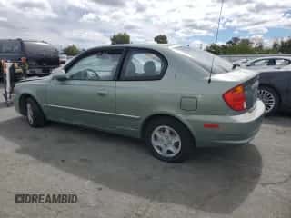 2003 Hyundai Accent GL with VIN KMHCG35C13U277732, listed as a Copart auction lot 72276634 with 135,176 mi miles and Salvage title. Bid and sale history available at DreamBid. Image 2.