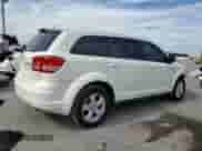 2013 Dodge Journey American Value with VIN 3C4PDCAB0DT575812, listed as a Copart auction lot 86771425 with 113,450 mi miles and Salvage title. Bid and sale history available at DreamBid. Image 3.