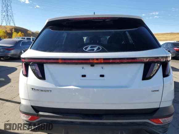 ✅ 2022 Hyundai Tucson SEL • VIN: 5NMJFCAE8NH033348 • Lot: 76280764. Wystawiony na Copart z przebiegiem 26 869 mil. Bezpłatny archiwum sprzedaży aukcyjnych z USA i szczegółowy raport historii pojazdu na DreamBid. Zdjęcie 6.