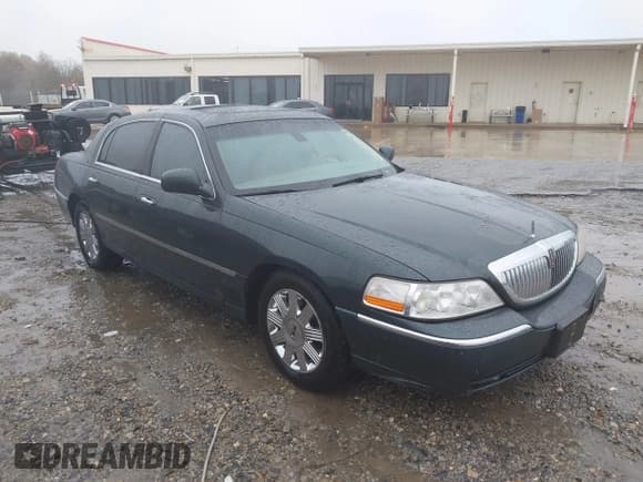 ✅ 2003 Lincoln Town Car Cartier • VIN: 1LNHM83W73Y651035 • Lot: 43579973. Listed on IAAI with 244,866 mi. Free auction sales archive from the USA and detailed vehicle history report at DreamBid. Image 1.