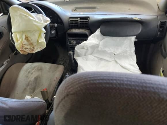 1999 Saturn SL z VIN 1G8ZF5281XZ273180, wystawiony jako Copart lot #86843915 z przebiegiem Nie podano mil oraz Szkoda całkowita • Salvage title. Historia ofert i sprzedaży dostępna na DreamBid. Obrazek 8.