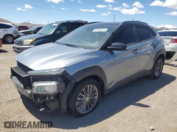 ✅ 2019 Hyundai Kona SEL • VIN: KM8K22AA2KU230586 • Лот: 52704374. Опубликован ранее на Copart с пробегом 55 757 миль. Бесплатный доступ к архиву аукционных продаж из США и подробный отчёт об истории автомобиля на DreamBid. Изображение 1.