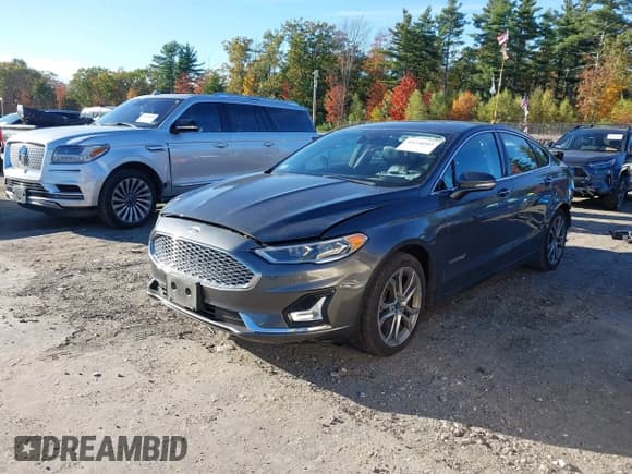 ✅ 2019 Ford Fusion Titanium • VIN: 3FA6P0RUXKR106542 • Lot: 43450593. Listed on IAAI with 141,675 mi. Free auction sales archive from the USA and detailed vehicle history report at DreamBid. Image 18.