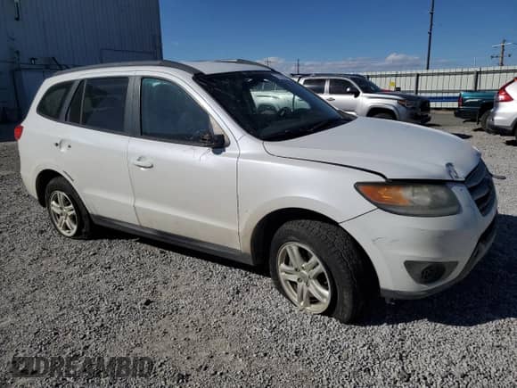 2012 Hyundai Santa Fe GLS с VIN 5XYZGDAB3CG151441, выставлен на аукционе Copart как лот 71148684 с пробегом Не указан миль и Списание • Salvage title. История ставок и продаж доступна на DreamBid. Изображение 4.