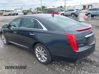 ✅ 2013 Cadillac XTS Premium • VIN: 2G61T5S32D9142784 • Лот: 42616365. Опубликован ранее на IAAI с пробегом 98 512 миль. Бесплатный доступ к архиву аукционных продаж из США и подробный отчёт об истории автомобиля на DreamBid. Изображение 3.