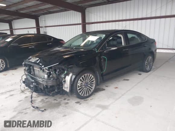 ✅ 2018 Ford Fusion Titanium • VIN: 3FA6P0D96JR138681 • Lot: 43520422. Listed on IAAI with 107,655 mi. Free auction sales archive from the USA and detailed vehicle history report at DreamBid. Image 2.