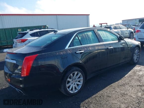 ✅ 2014 Cadillac CTS AWD • VIN: 1G6AW5SX1E0159081 • Lot: 43656547. Listed on IAAI with 105,828 mi. Free auction sales archive from the USA and detailed vehicle history report at DreamBid. Image 4.