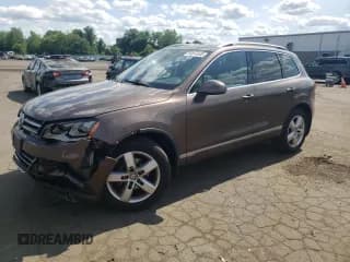 ✅ 2012 Volkswagen Touareg Lux • VIN: WVGEK9BP1CD006512 • Lot: 58614845. Listed on Copart with 139,861 mi. Free auction sales archive from the USA and detailed vehicle history report at DreamBid. Image 1.