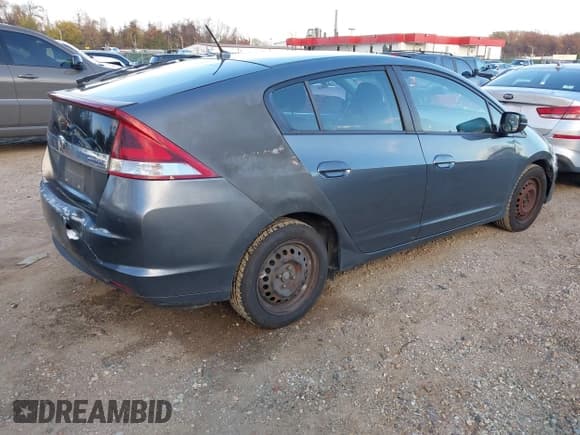 ✅ 2013 Honda Insight LX • VIN: JHMZE2H57DS004186 • Lot: 43671873. Listed on IAAI with 276,397 mi. Free auction sales archive from the USA and detailed vehicle history report at DreamBid. Image 4.