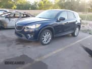 ✅ 2014 Mazda CX-5 Grand Touring • VIN: JM3KE4DY7E0424131 • Lot: 42847859. Listed on IAAI with 148,106 mi. Free auction sales archive from the USA and detailed vehicle history report at DreamBid. Image 17.