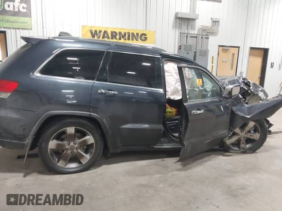 2014 Jeep Grand Cherokee Limited z VIN 1C4RJFBG0EC213215, wystawiony jako IAAI lot #43260723 z przebiegiem Nie podano mil oraz . Historia ofert i sprzedaży dostępna na DreamBid. Obrazek 13.