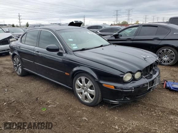 ✅ 2004 Jaguar X-Type • VIN: SAJEA51C24WE08340 • Lot: 82683605. Listed on Copart with 202,758 mi. Free auction sales archive from the USA and detailed vehicle history report at DreamBid. Image 4.