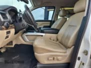 ✅ 2016 Nissan Titan Platinum Reserve • VIN: 1N6BA1F4XGN504751 • Lot: 90842885. Listed on Copart with 143,772 mi. Free auction sales archive from the USA and detailed vehicle history report at DreamBid. Image 7.