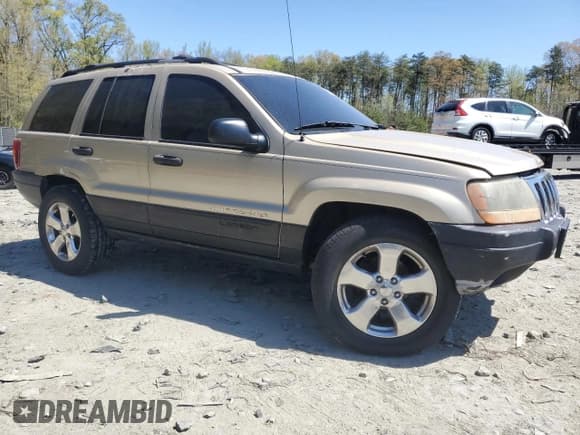 ✅ 2001 Jeep Grand Cherokee Laredo • VIN: 1J4GW48SX1C621136 • Lot: 53713195. Listed on Copart with 252,444 mi. Free auction sales archive from the USA and detailed vehicle history report at DreamBid. Image 4.