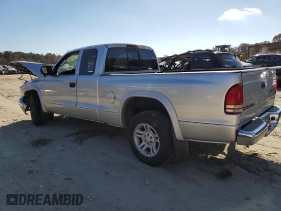 2003 Dodge Dakota SLT with VIN 1D7HL42N53S266476, listed as a Copart auction lot 79446004 with 139,911 mi miles and Salvage title. Bid and sale history available at DreamBid. Image 2.