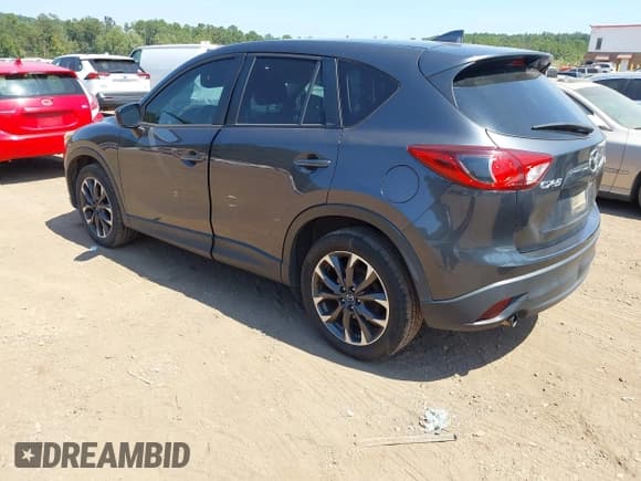 ✅ 2016 Mazda CX-5 Grand Touring • VIN: JM3KE2DYXG0769581 • Lot: 43174558. Listed on IAAI with 206,517 mi. Free auction sales archive from the USA and detailed vehicle history report at DreamBid. Image 3.