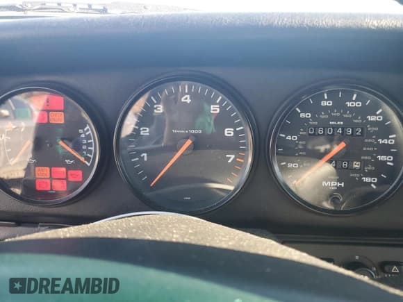 ✅ 1996 Porsche 911 • VIN: WP0DA2996TS385231 • Lot: 83699964. Wystawiony na Copart z przebiegiem 60 492 mil. Bezpłatny archiwum sprzedaży aukcyjnych z USA i szczegółowy raport historii pojazdu na DreamBid. Zdjęcie 9.