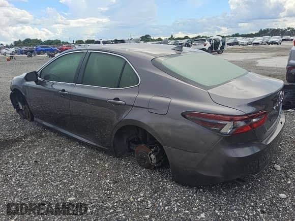 2023 Toyota Camry Hybrid LE with VIN 4T1C31AK3PU608653, listed as a Copart auction lot 59235965 with 57,095 mi miles and Clean title. Bid and sale history available at DreamBid. Image 2.