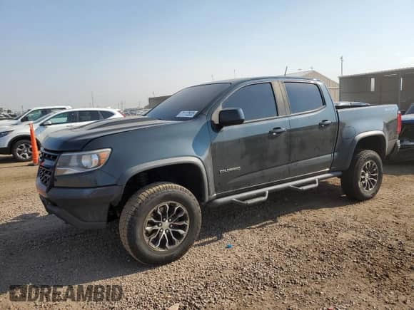 2018 Chevrolet Colorado 4WD ZR2 with VIN 1GCGTEEN7J1206189, listed as a Copart auction lot 71172835 with 136,672 mi miles and Salvage title. Bid and sale history available at DreamBid. Image 1.