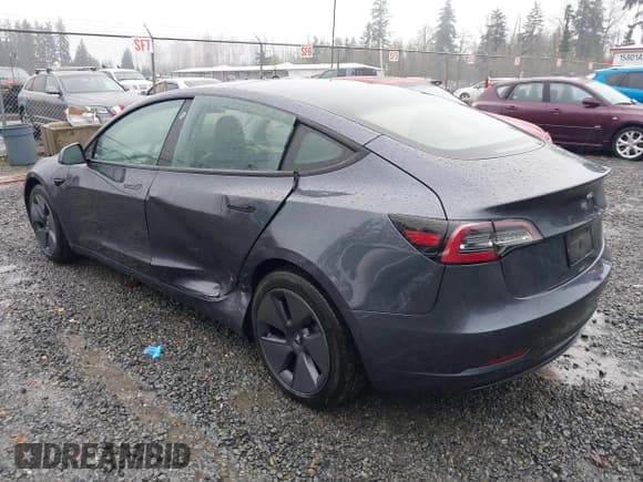 ✅ 2021 Tesla Model 3 Standard Range Plus • VIN: 5YJ3E1EA7MF985667 • Lot: 43848377. Listed on IAAI with 26,627 mi. Free auction sales archive from the USA and detailed vehicle history report at DreamBid. Image 3.