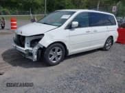 ✅ 2010 Honda Odyssey Touring • VIN: 5FNRL3H90AB039449 • Lot: 42032203. Listed on IAAI with 128,265 mi. Free auction sales archive from the USA and detailed vehicle history report at DreamBid. Image 2.