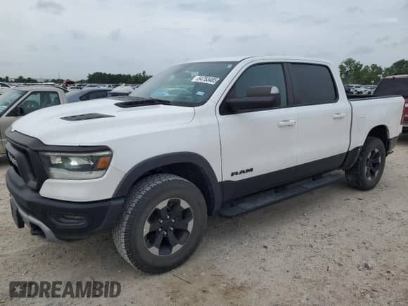 2020 Ram 1500 Rebel z VIN 1C6RRELT2LN303523, wystawiony jako Copart lot #54753485 z przebiegiem 90 533 mil mil oraz Szkoda całkowita • Salvage title. Historia ofert i sprzedaży dostępna na DreamBid. Obrazek 1.