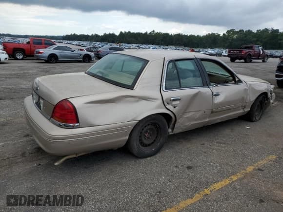 ✅ 1998 Ford Crown Victoria • VIN: 2FAFP73W0WX162676 • Lot: 71668134. Listed on Copart with 106,167 mi. Free auction sales archive from the USA and detailed vehicle history report at DreamBid. Image 3.