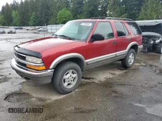 ✅ 1999 Chevrolet Blazer LT • VIN: 1GNDT13W7X2243230 • Lot: 57298805. Wystawiony na Copart z przebiegiem 230 907 mil. Bezpłatny archiwum sprzedaży aukcyjnych z USA i szczegółowy raport historii pojazdu na DreamBid. Zdjęcie 1.