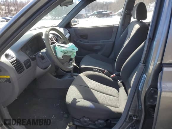 2003 Hyundai Accent GL with VIN KMHCG45C33U469496, listed as a Copart auction lot 45926595 with 77,737 mi miles and Salvage title. Bid and sale history available at DreamBid. Image 7.