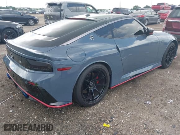 ✅ 2024 Nissan Z Nismo • VIN: JN1BZ4CH7RM360818 • Lot: 42733312. Listed on IAAI with 3,306 mi. Free auction sales archive from the USA and detailed vehicle history report at DreamBid. Image 4.