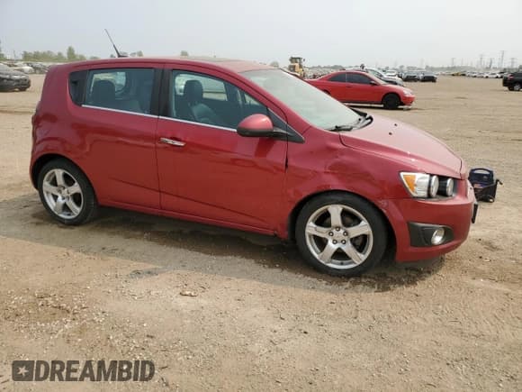 ✅ 2012 Chevrolet Sonic LTZ • VIN: 1G1JE6SH7C4111176 • Lot: 59002575. Listed on Copart with 116,640 mi. Free auction sales archive from the USA and detailed vehicle history report at DreamBid. Image 4.