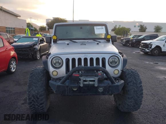 ✅ 2012 Jeep Wrangler Unlimited Sport • VIN: 1C4BJWDG8CL143023 • Lot: 43447646. Listed on IAAI with 119,924 mi. Free auction sales archive from the USA and detailed vehicle history report at DreamBid. Image 12.