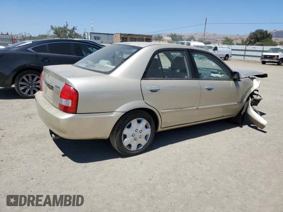 ✅ 2001 Mazda Protege LX • VIN: JM1BJ225610452367 • Lot: 65087615. Wystawiony na Copart z przebiegiem 212 110 mil. Bezpłatny archiwum sprzedaży aukcyjnych z USA i szczegółowy raport historii pojazdu na DreamBid. Zdjęcie 3.